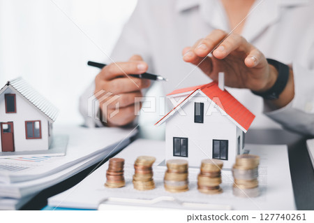 Concept business house finance protection office plan investment buy sell home ensuring idea financial security. residence agent hand protect purchase insurance and secure favorable loan deal. 127740261