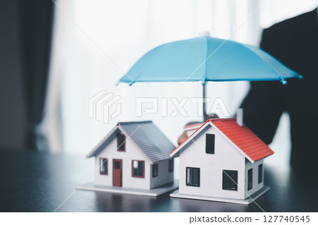 Concept business house finance protection office plan investment buy sell home ensuring idea financial security. residence agent hand protect purchase insurance and secure favorable loan deal. 127740545
