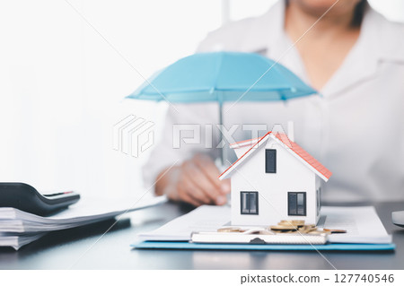 Concept business house finance protection office plan investment buy sell home ensuring idea financial security. residence agent hand protect purchase insurance and secure favorable loan deal. 127740546