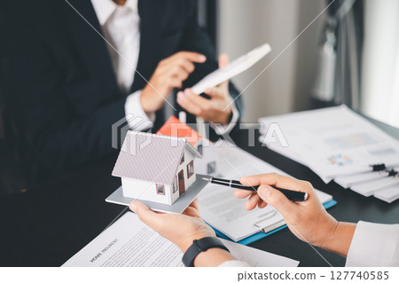 Concept business house finance protection office plan investment buy sell home ensuring idea financial security. residence agent hand protect purchase insurance and secure favorable loan deal. 127740585
