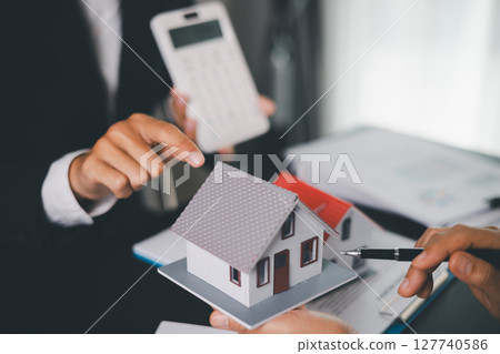 Concept business house finance protection office plan investment buy sell home ensuring idea financial security. residence agent hand protect purchase insurance and secure favorable loan deal. 127740586
