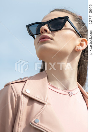 Beautiful woman with long dark hair and sunglasses outdoor close-up portrait Beautiful woman with long dark hair and sunglasses outdoor close-up portrait 127740646