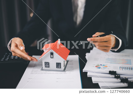 Concept business house finance protection office plan investment buy sell home ensuring idea financial security. residence agent hand protect purchase insurance and secure favorable loan deal. Concept business house finance protection office plan investment buy sell home ensuring idea financial security. residence agent hand protect purchase insurance and secure favorable loan deal. 127740660