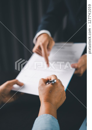 Business people signing contract making deal with life insurance agent Concept for consultant health insurance life insurance savings plan. Approved stamp with Business people contract making deal Business people signing contract making deal with life insurance agent Concept for consultant health insurance life insurance savings plan. Approved stamp with Business people contract making deal 127741059