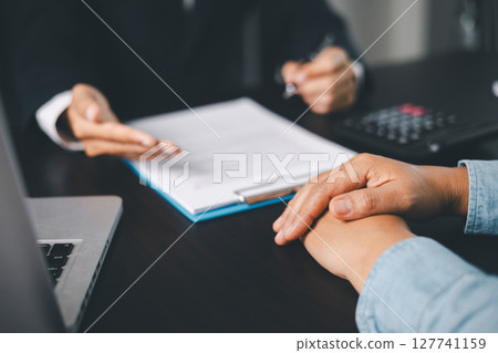 Business people signing contract making deal with life insurance agent Concept for consultant health insurance life insurance savings plan. Approved stamp with Business people contract making deal 127741159