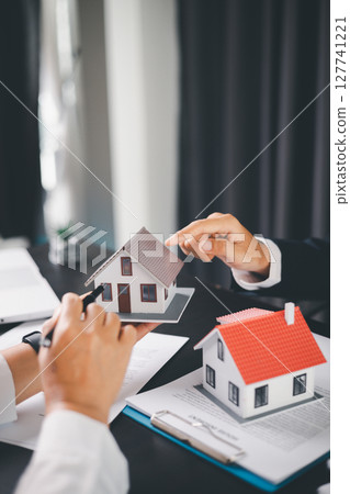 Concept business house finance protection office plan investment buy sell home ensuring idea financial security. residence agent hand protect purchase insurance and secure favorable loan deal. 127741221