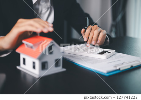 Concept business house finance protection office plan investment buy sell home ensuring idea financial security. residence agent hand protect purchase insurance and secure favorable loan deal. Concept business house finance protection office plan investment buy sell home ensuring idea financial security. residence agent hand protect purchase insurance and secure favorable loan deal. 127741222