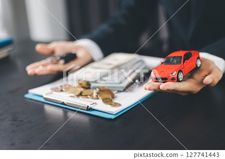 Concept business vehicle finance protection office plan investment buy sell car ensuring idea financial security. automobile agent hand protect purchase insurance and secure favorable loan deal. 127741443