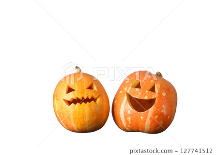 Carved pumpkins with playful and spooky faces, isolated on white, PNG Carved pumpkins with playful and spooky faces, isolated on white, PNG 127741512