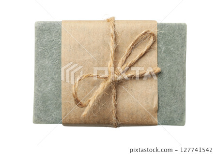 Elegant handmade soap in brown paper, isolated on white, PNG 127741542