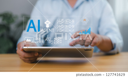 Person using a tablet to AI agent concepts, showcasing artificial intelligence assistant tools, machine learning, automation, chatbots, data analysis, smart technology for future business solutions. 127741629