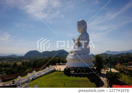 Big Guanyin at Huai Plakang temple in Chiangrai Thailand during twilight sunset time, public place in north of Thai Asia Big Guanyin at Huai Plakang temple in Chiangrai Thailand during twilight sunset time, public place in north of Thai Asia 127741678