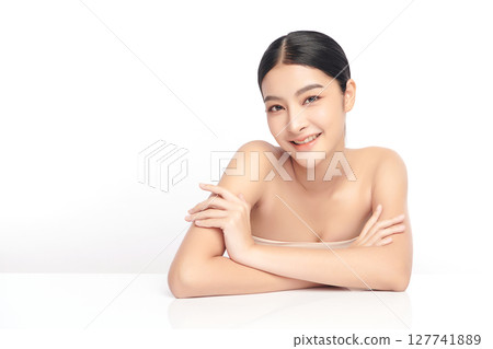 A beautiful young Asian woman with clean, fresh skin against a white background. Skincare, facial treatment, cosmetology, beauty, and spa. An elegant portrait of an Asian woman. A beautiful young Asian woman with clean, fresh skin against a white background. Skincare, facial treatment, cosmetology, beauty, and spa. An elegant portrait of an Asian woman. 127741889