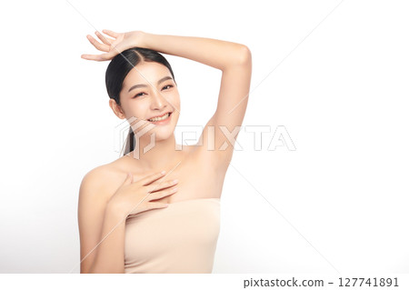 Beautiful Young Asian woman Raises her hands to Showcase clean and hygienic underarms Against a white background, Smooth armpit cleanliness and protection concept Beautiful Young Asian woman Raises her hands to Showcase clean and hygienic underarms Against a white background, Smooth armpit cleanliness and protection concept 127741891
