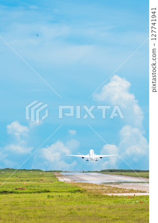 A spectacular passenger plane takes off from Shimojishima Airport 127741941