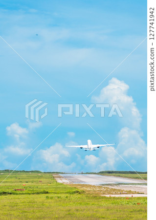 A spectacular passenger plane takes off from Shimojishima Airport 127741942