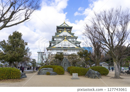 Osaka, Japan - Dec 30, 2022 : People sightseeing at Osaka castle in Osaka, Japan on Dec 30, 2022. 127743061