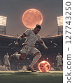 A football player in full athletic gear, poised to kick the ball with explosive power, under the bright stadium lights. Motivational concept for football lovers. 127743250