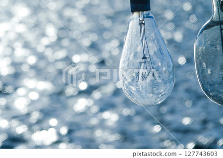 A nostalgic scene with the sparkling sea and fishing boats' fishing lights A nostalgic scene with the sparkling sea and fishing boats' fishing lights 127743603