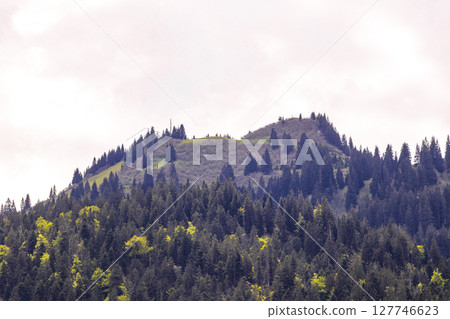 Tyrol Austria alpine mountain and hill landscape panorama cloudy sky. Tyrol Austria alpine mountain and hill landscape panorama cloudy sky. 127746623