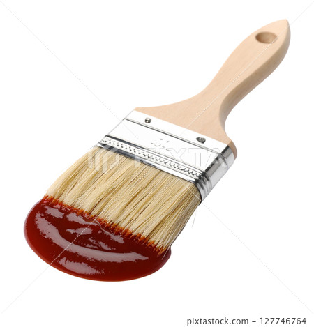 A single artist's paintbrush with a wooden handle and metal ferrule, loaded with vibrant color, stands isolated as an essential tool for painting and creative art work A single artist's paintbrush with a wooden handle and metal ferrule, loaded with vibrant color, stands isolated as an essential tool for painting and creative art work 127746764