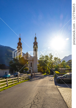 Barbara church cathedral Barbarakirche Fliess with blue sky Tyrol Austria. 127746853