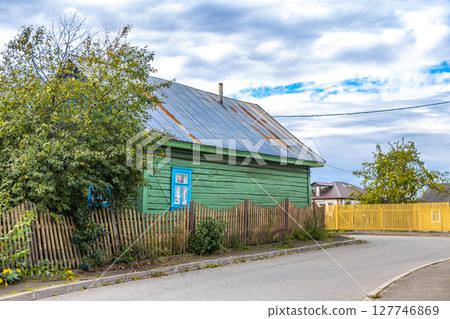 Mir Belarus Colorful Village Streets with Wooden Huts Cabins Houses. Mir Belarus Colorful Village Streets with Wooden Huts Cabins Houses. 127746869