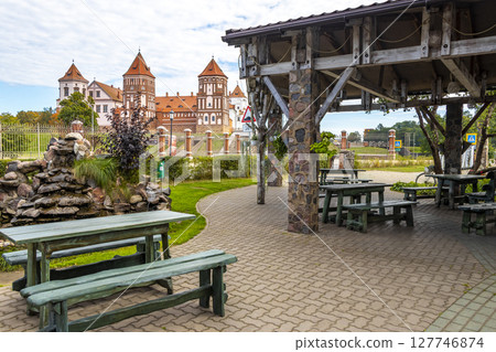 Mir Castle majestic fortification fortress Park cafe restaurant benches Belarus. 127746874