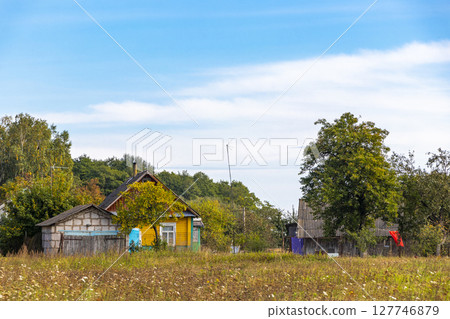 Mir Belarus Colorful Village Streets with Wooden Huts Cabins Houses. 127746879