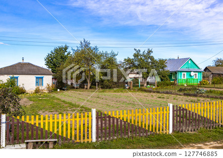 Mir Belarus Colorful Village Streets with Wooden Huts Cabins Houses. 127746885