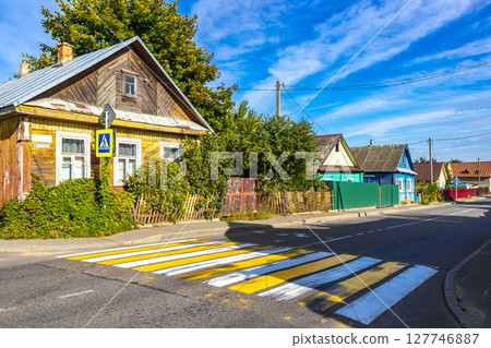 Mir Belarus Colorful Village Streets with Wooden Huts Cabins Houses. Mir Belarus Colorful Village Streets with Wooden Huts Cabins Houses. 127746887