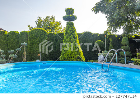 Beautiful pool in the garden in Brest Belarus. Beautiful pool in the garden in Brest Belarus. 127747114