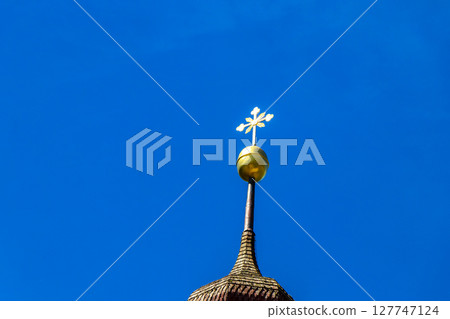 Barbara church cathedral with dome tower blue sky Tyrol Austria. Barbara church cathedral with dome tower blue sky Tyrol Austria. 127747124