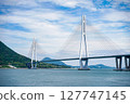 A view of the Seto Inland Sea overlooking the Tatara Bridge and Ikuchijima Island | A spectacular view of blue skies and white clouds 127747145