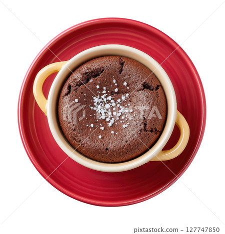 Delicious Chocolate Lava Cake Served in a Cute Bowl on a Bright Red Plate with a Sprinkle of Sea Salt 127747850