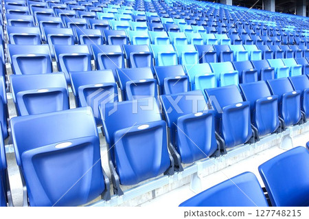 Seats lined up in the stadium 127748215