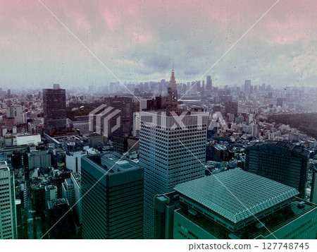 Rainy cityscape enveloped in magic hour Rainy cityscape enveloped in magic hour 127748745