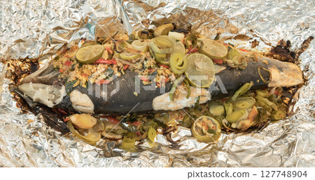 Baked Whole Salmon with Herbs in an Oven. Baked Whole Salmon with Herbs in an Oven. 127748904