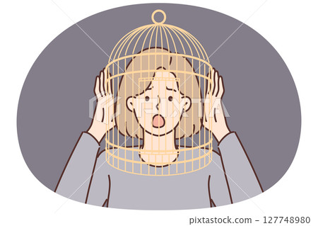 Girl with cage on head screams having fallen into mental trap negatively affects psychological state 127748980