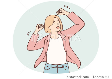 Successful woman raises hands up making victory gesture after triumph of own business 127748985