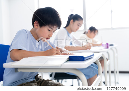 Children studying at school Children studying at school 127749009