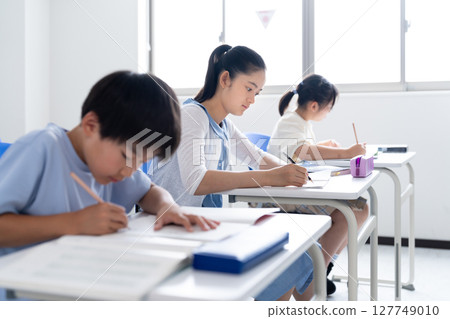Children studying at school Children studying at school 127749010