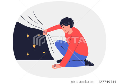 Man looks at starry sky hidden under fabric, experiencing curiosity at sight of unknown starry space 127749144