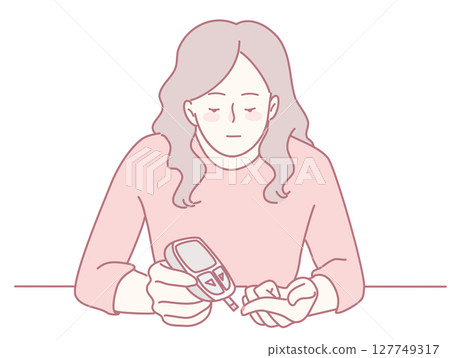 A woman diligently monitoring her blood sugar levels using a glucometer device for health 127749317