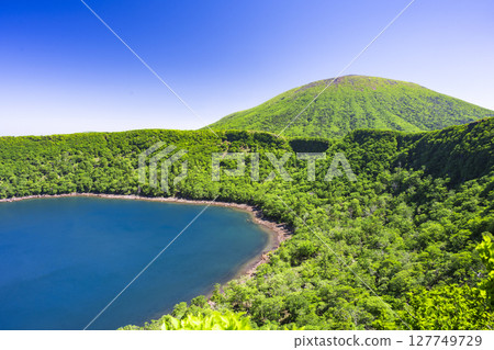 View of Mt. Karakunidake from the deep green of Onami Pond 127749729