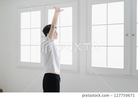 Young man wearing a T-shirt Lifestyle image Young man wearing a T-shirt Lifestyle image 127750671