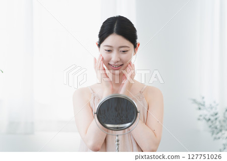 Beauty image of a young woman doing skin care 127751026
