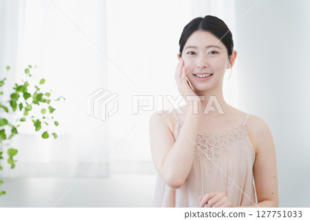 Beauty image of a young woman doing skin care 127751033