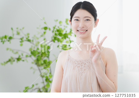 Beauty image of a young woman doing skin care Beauty image of a young woman doing skin care 127751035