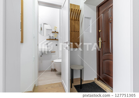 Modern Entryway with View into Minimalist Bathroom Modern Entryway with View into Minimalist Bathroom 127751305
